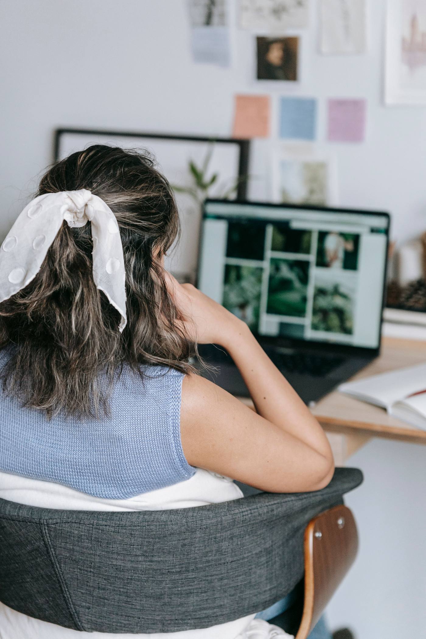 Late at night, a business owner relaxes while her AI command center answers customers and books leads on her laptop